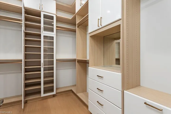 Spacious closet featuring light wood-type flooring