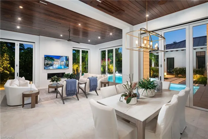 Sunroom featuring a chandelier