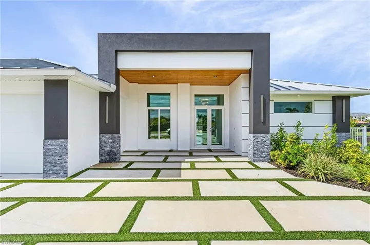 Property entrance featuring french doors