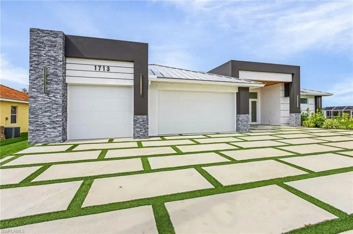View of front facade featuring a garage