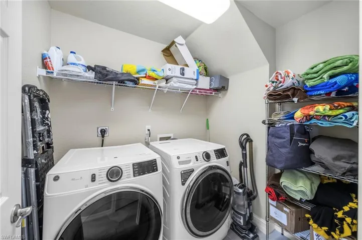 Washroom featuring washer and clothes dryer