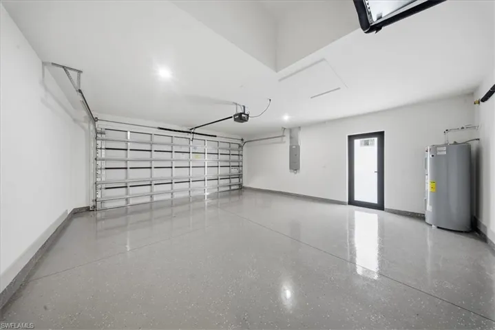 Garage with electric water heater and electric panel