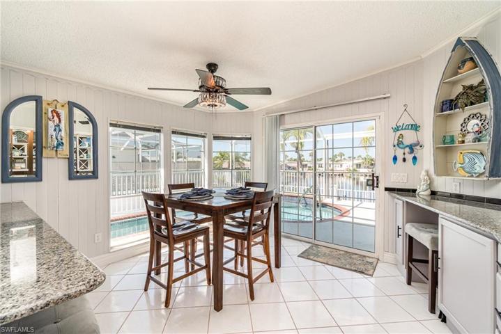 Eat at counter and breakfast nook with great views of the pool and canal