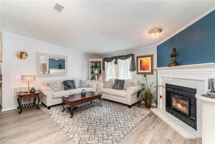 Formal living or conversation area with electric fireplace