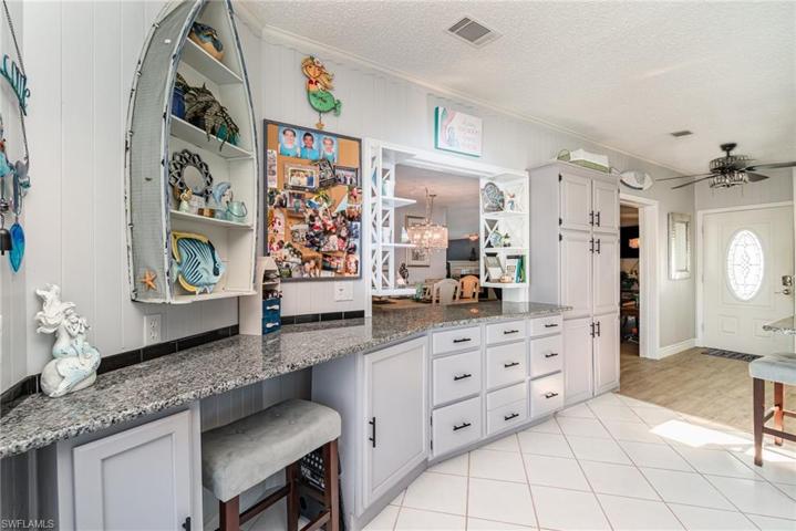 workspace and spacious pantry with pass-thru to formal dining area.