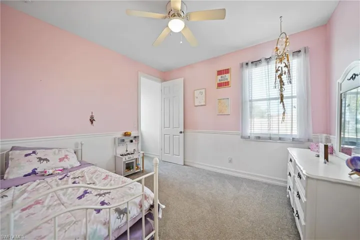 3rd Bedroom Featuring a Walk-In Closet with Natural Light