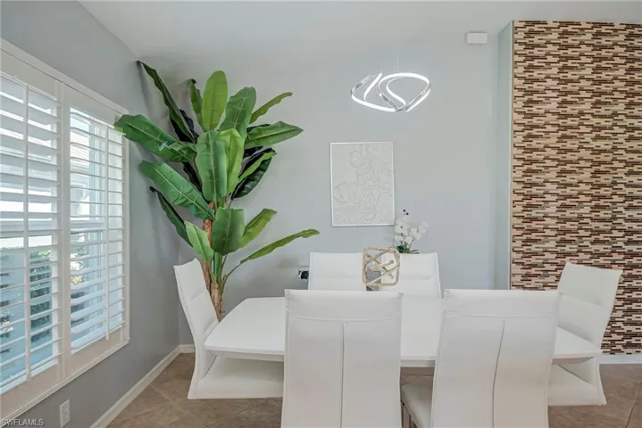 Dining room featuring light tile patterned flooring