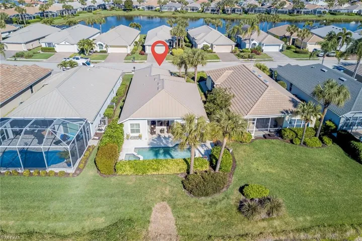 Aerial view of residential area with a nearby body of water