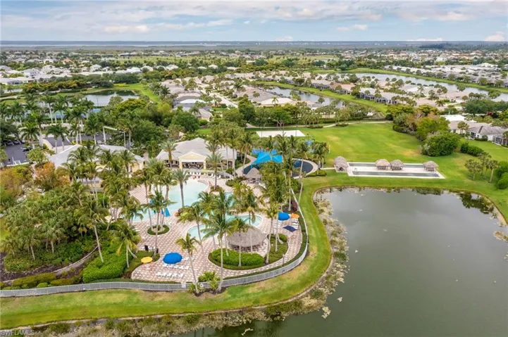 Aerial overview of property's location with nearby suburban area and a nearby body of water