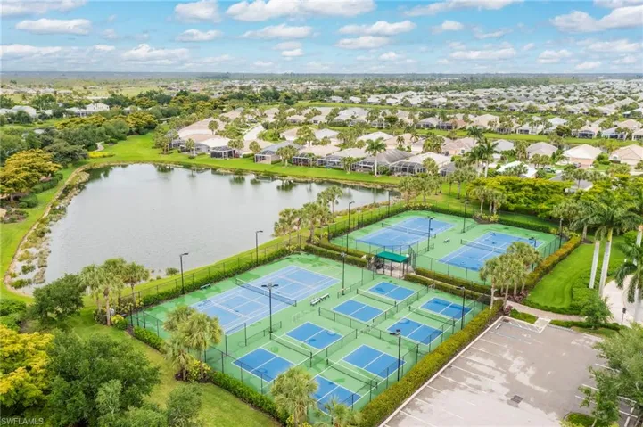 Aerial perspective of suburban area with a large body of water