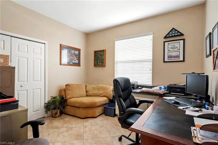 Office space featuring light tile patterned floors