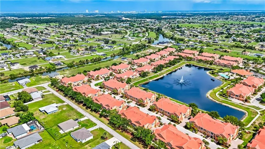 Aerial view of residential area featuring a large body of water
