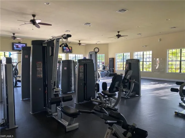 Gym featuring ceiling fan and recessed lighting