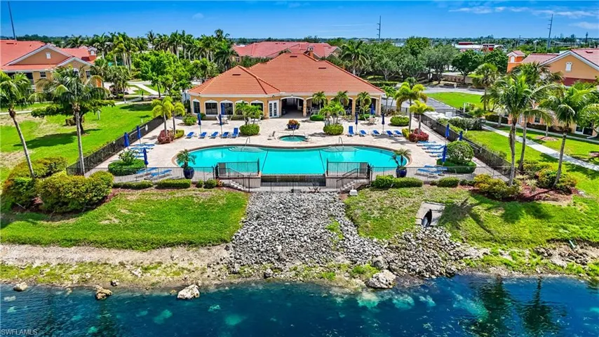 Community pool with a patio and a community hot tub