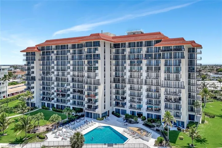 View of apartment building / complex featuring a community pool