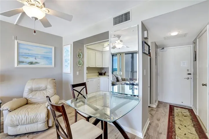 Dining room featuring ceiling fan, light wood-style floors, and baseboards