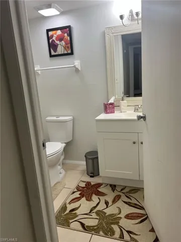 Bathroom with vanity and tile patterned floors