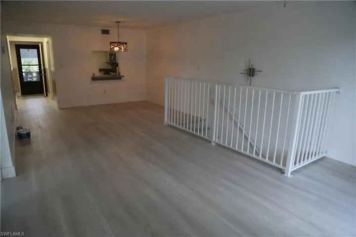 Empty room featuring light wood finished floors and baseboards
