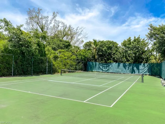 View of tennis court with community basketball court