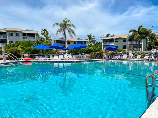 Community pool featuring a patio