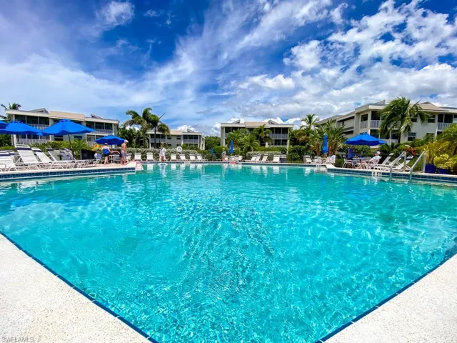 Community pool with a patio area