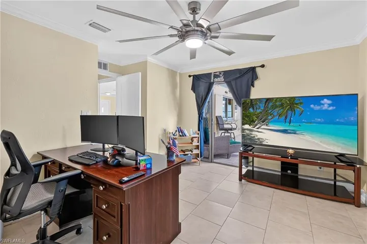Guest bed #2 with access to pool and lanai Recessed lighting, crown molding, and tile flooring