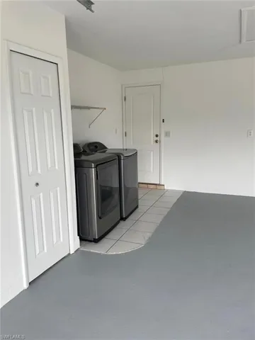 Laundry room featuring washer and clothes dryer and laundry area
