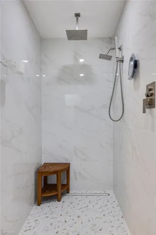 Beautiful floors, walls and an almost undetectable drain!!