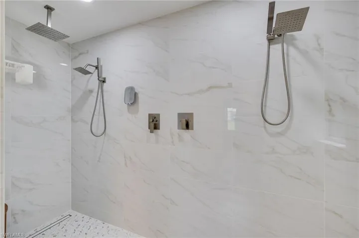 Look at all those shower heads (take your pick!) and the size of this newly remodeled shower area!