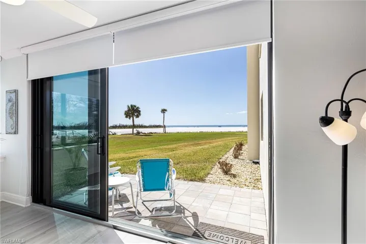 Entryway featuring a water view, hardwood / wood-style flooring, and plenty of natural light