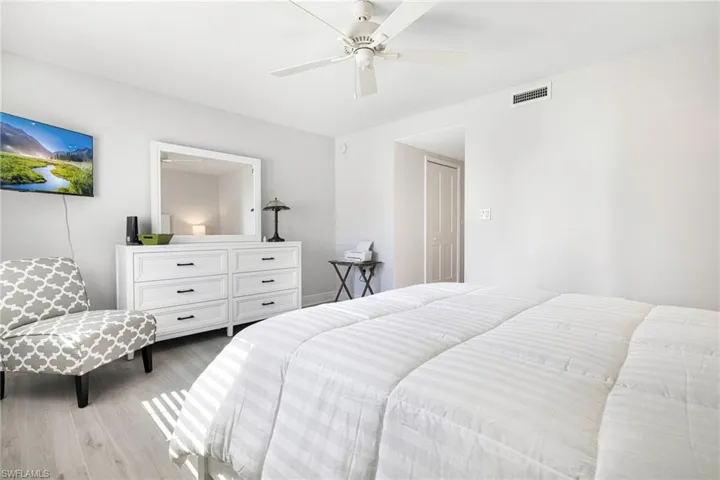 Bedroom featuring light hardwood / wood-style floors and ceiling fan