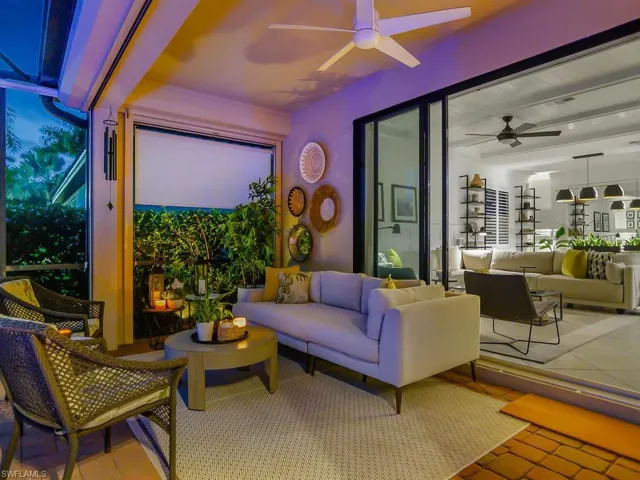 View of patio featuring an outdoor living space and ceiling fan