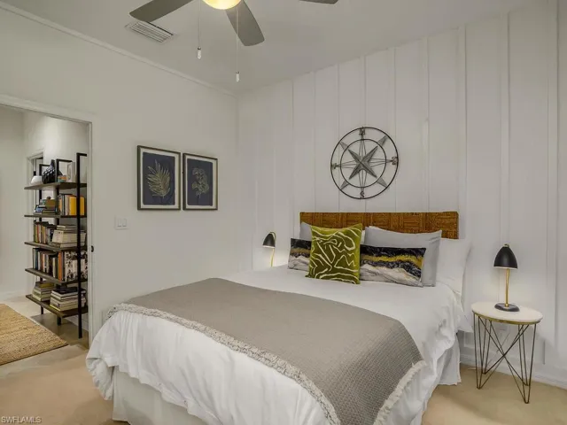 Carpeted bedroom with ceiling fan