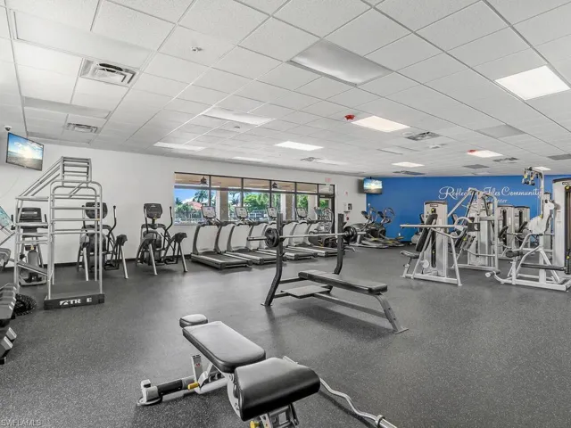 Workout area featuring a drop ceiling