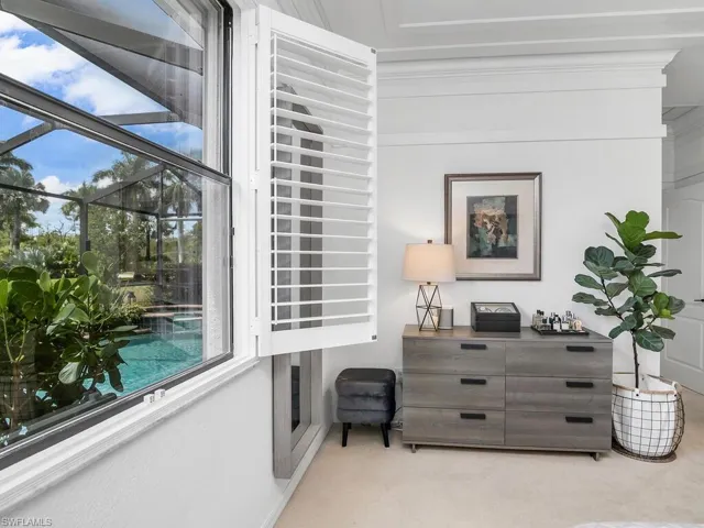 Sitting room featuring light colored carpet