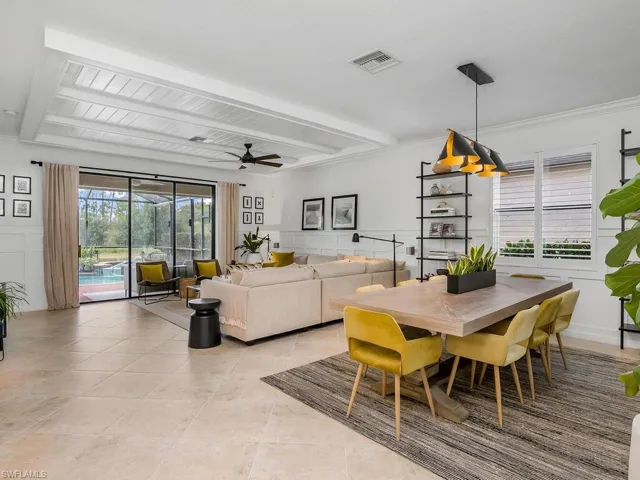 Dining space featuring ceiling fan and light tile patterned flooring