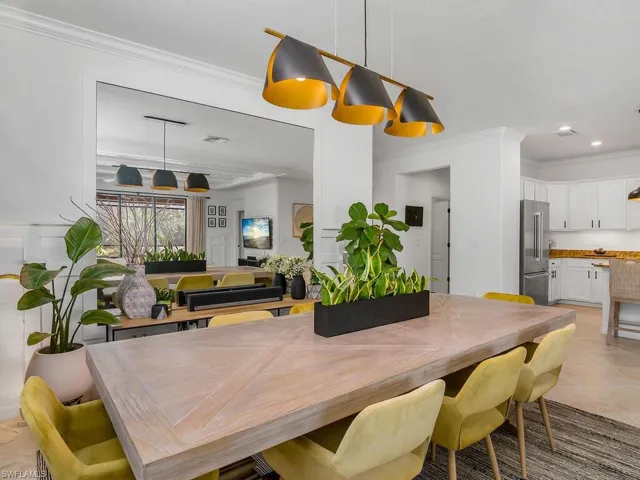 Dining area featuring crown molding