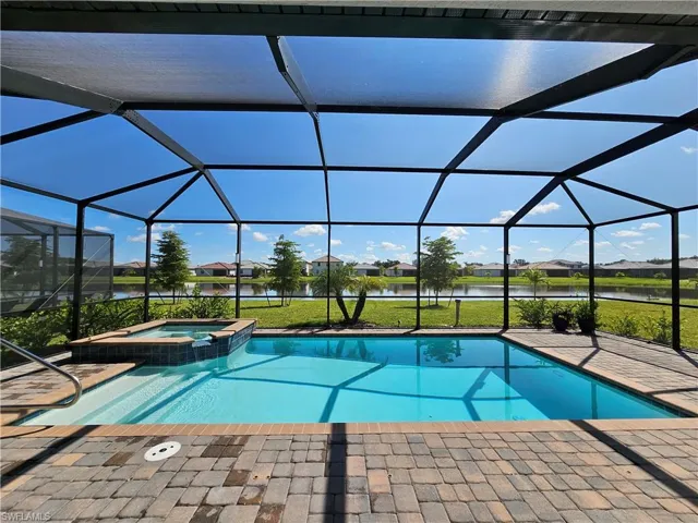 View of swimming pool featuring a Pool & Spa, a water view