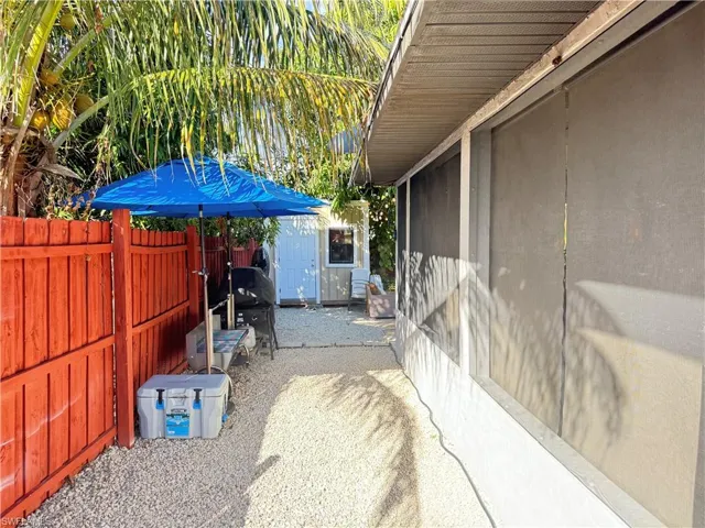 View of patio featuring a shed
