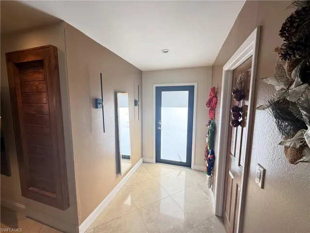 Entryway featuring tile patterned flooring