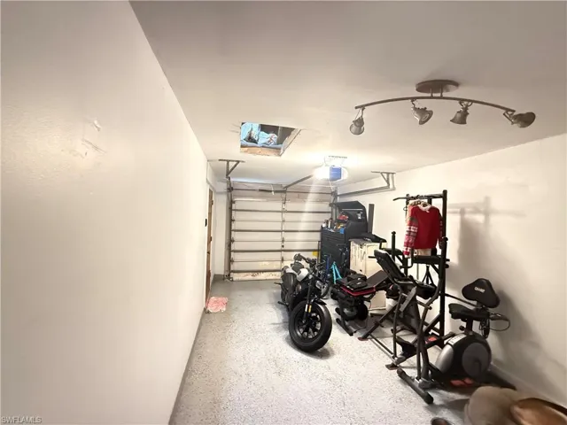 Garage featuring a garage door opener