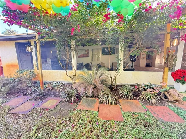 View of yard with a sunroom