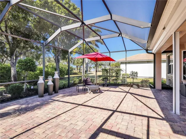 View of patio / terrace featuring glass enclosure and a sunroom
