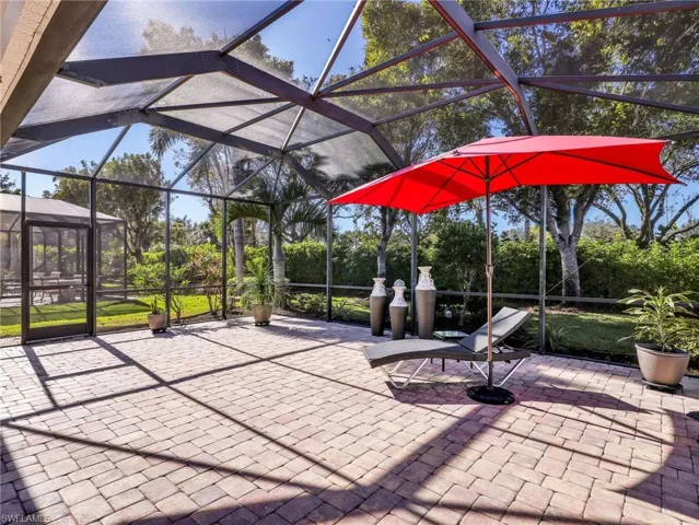 View of patio / terrace featuring a lanai and a sunroom