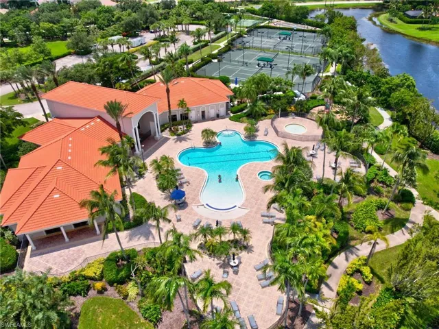 Drone / aerial view of a large body of water and a pool