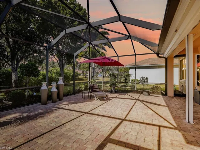 View of patio featuring a lanai and a sunroom