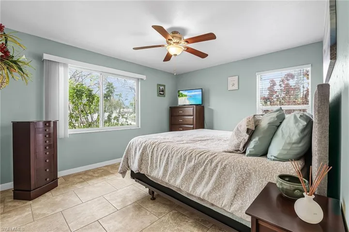 Bedroom featuring a ceiling fan and light tile patterned floors