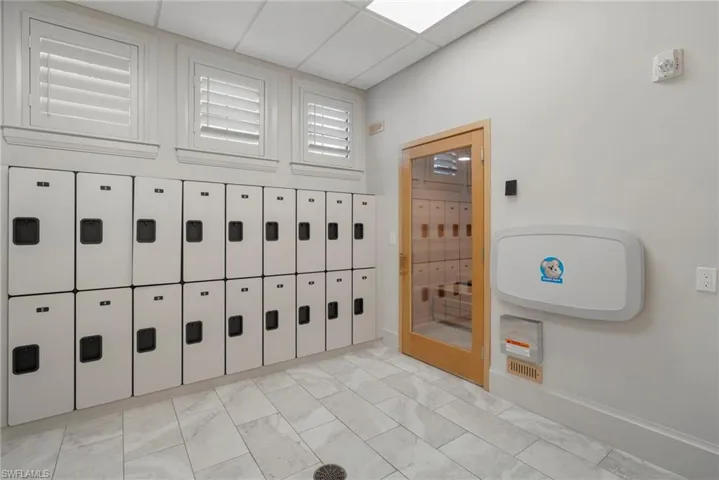 View of property's community featuring mail area and a paneled ceiling