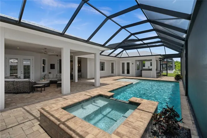 Heated saltwater pool and spa, outdoor kitchen and huge lanai