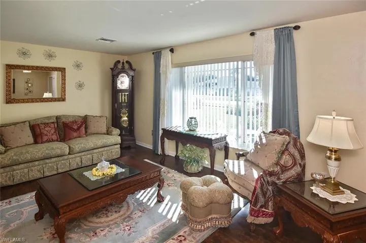 The large southern-facing picture window highlights the beauty of this elegant home!